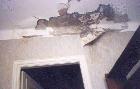 [Photo of the damaged apartment]
